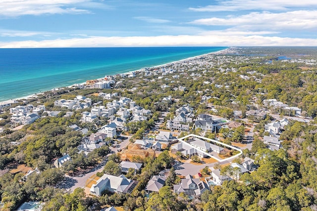 aerial view featuring a residential view, a water view, and a view of the beach