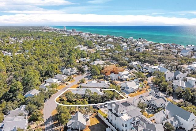 birds eye view of property with a water view and a residential view