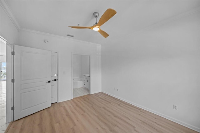 212 Harbor Blvd Unit 205, Destin, FL 32541 - unfurnished bedroom with ornamental molding, light wood finished floors, connected bathroom, baseboards, and ceiling fan