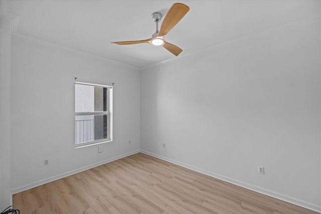 212 Harbor Blvd Unit 205, Destin, FL 32541 - spare room featuring ornamental molding, light wood finished floors, baseboards, and ceiling fan