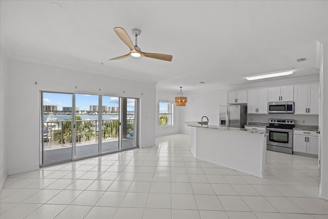 212 Harbor Blvd Unit 205, Destin, FL 32541 - kitchen featuring stainless steel appliances, crown molding, open floor plan, a chandelier, and ceiling fan