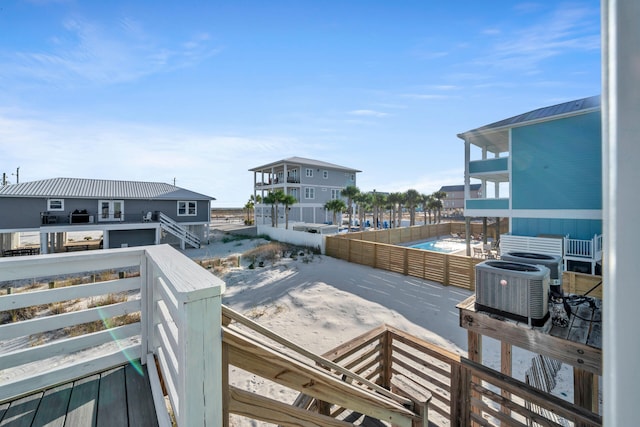 wooden terrace featuring central air condition unit