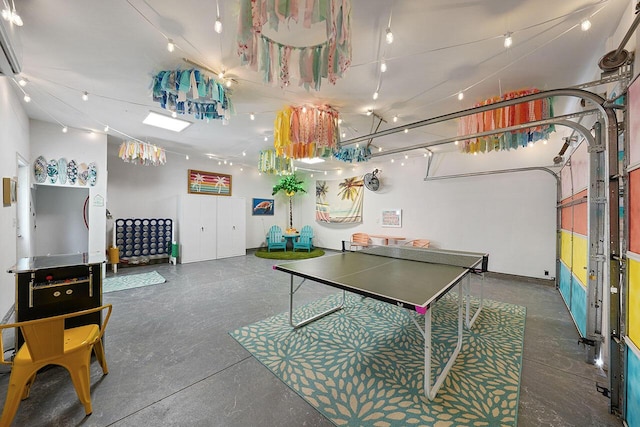 54 Dune Dr, Santa Rosa Beach, FL 32459 - recreation room with concrete flooring and a garage