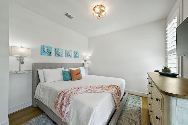 54 Dune Dr, Santa Rosa Beach, FL 32459 - bedroom featuring baseboards, visible vents, and wood finished floors