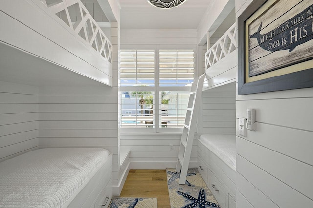 54 Dune Dr, Santa Rosa Beach, FL 32459 - bedroom featuring wooden walls and wood finished floors