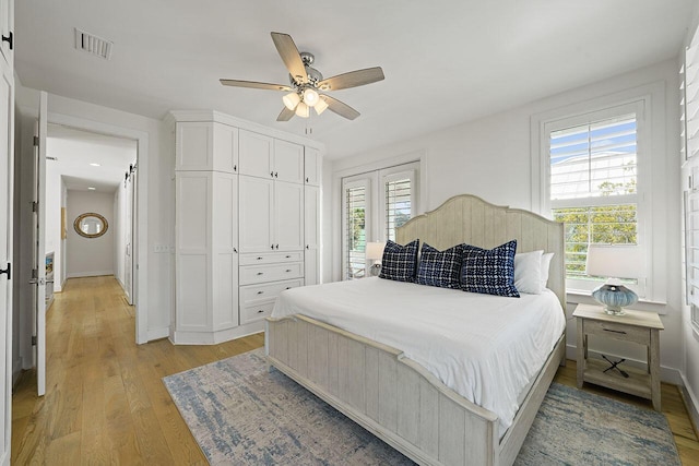 54 Dune Dr, Santa Rosa Beach, FL 32459 - bedroom with ceiling fan, baseboards, light wood finished floors, and visible vents