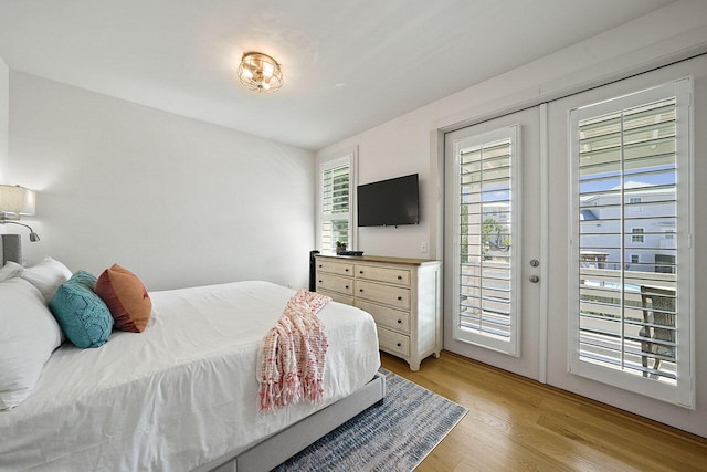 54 Dune Dr, Santa Rosa Beach, FL 32459 - bedroom with access to exterior and light wood-type flooring