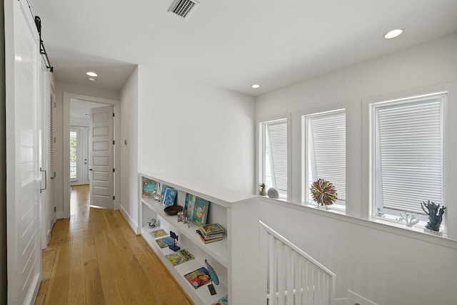 54 Dune Dr, Santa Rosa Beach, FL 32459 - corridor featuring recessed lighting, visible vents, and light wood-style floors