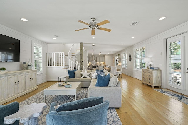 54 Dune Dr, Santa Rosa Beach, FL 32459 - living room featuring light wood-style floors, visible vents, stairway, and a ceiling fan