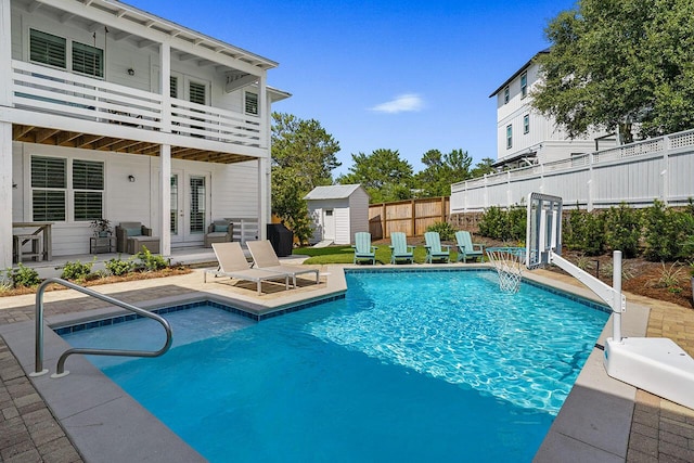 54 Dune Dr, Santa Rosa Beach, FL 32459 - view of swimming pool with a patio area, french doors, an outbuilding, fence, and a storage shed