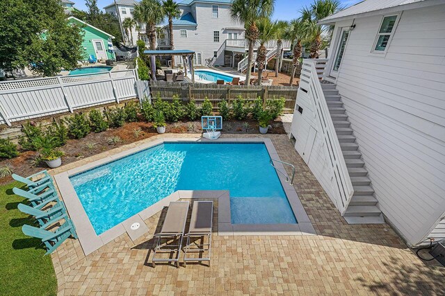54 Dune Dr, Santa Rosa Beach, FL 32459 - view of swimming pool with a fenced backyard, a patio area, stairway, and a fenced in pool
