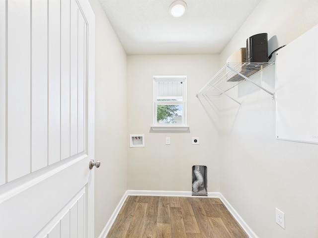 643 Earl Godwin Rd, Freeport, FL 32439 - laundry area featuring hookup for a washing machine, baseboards, wood finished floors, and electric dryer hookup