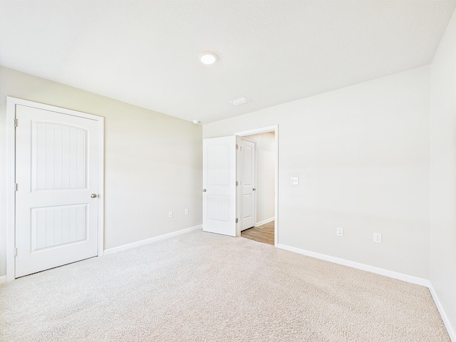 643 Earl Godwin Rd, Freeport, FL 32439 - unfurnished bedroom with baseboards and carpet floors