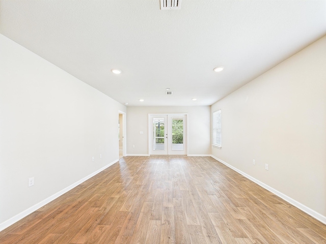 643 Earl Godwin Rd, Freeport, FL 32439 - spare room with light wood-style floors, baseboards, recessed lighting, and french doors