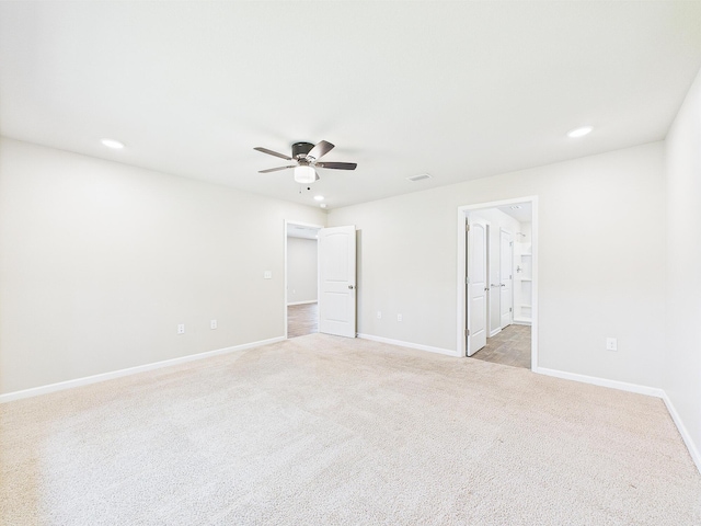 643 Earl Godwin Rd, Freeport, FL 32439 - unfurnished bedroom with light carpet, baseboards, recessed lighting, ceiling fan, and ensuite bath