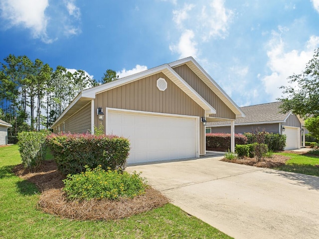 643 Earl Godwin Rd, Freeport, FL 32439 - view of front facade featuring concrete driveway and an outbuilding