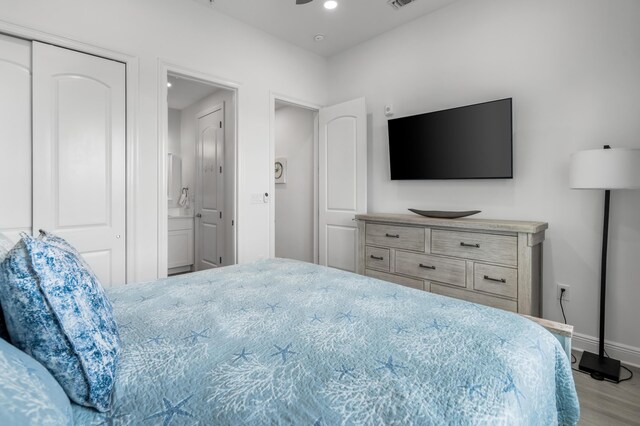 1740 S County Highway 393 # 301, Santa Rosa Beach, FL 32459 - bedroom featuring baseboards, ensuite bath, wood finished floors, and recessed lighting