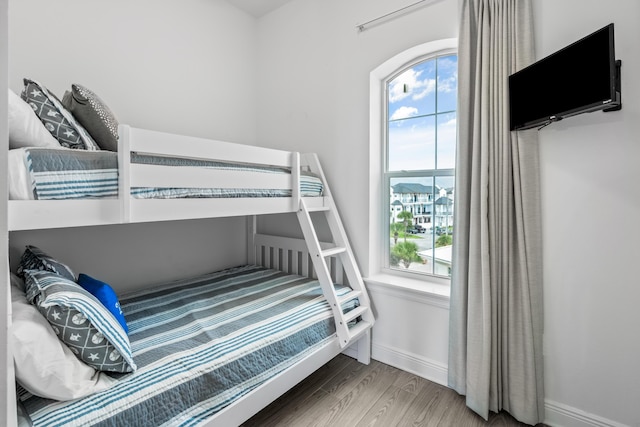 1740 S County Highway 393 # 301, Santa Rosa Beach, FL 32459 - bedroom featuring multiple windows, wood finished floors, and baseboards