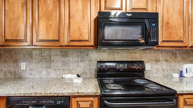 2374 County Highway 280a, Defuniak Springs, FL 32435 - kitchen with black appliances, brown cabinets, and decorative backsplash