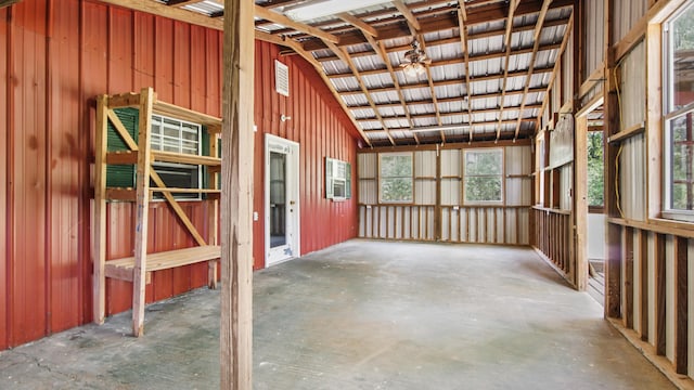 2374 County Highway 280a, Defuniak Springs, FL 32435 - miscellaneous room featuring unfinished concrete flooring, wood walls, and lofted ceiling