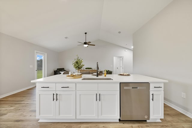 3202 Liz Ct, Crestview, FL 32539 - kitchen featuring dishwasher, a sink, white cabinets, vaulted ceiling, and light wood-style flooring