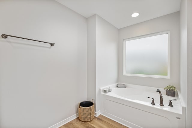 3202 Liz Ct, Crestview, FL 32539 - bathroom with wood finished floors, a garden tub, and baseboards