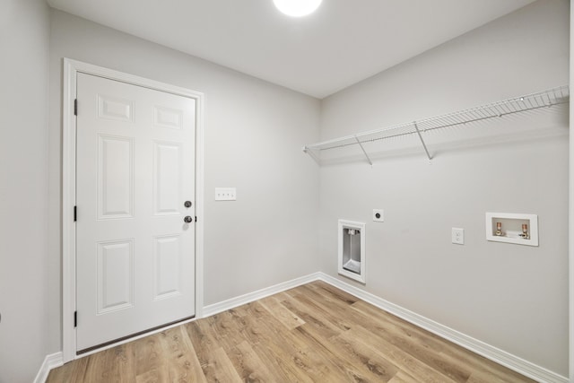 3202 Liz Ct, Crestview, FL 32539 - clothes washing area featuring electric dryer hookup, hookup for a washing machine, light wood-style flooring, and baseboards