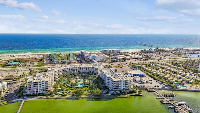 birds eye view of property featuring a city view and a water view