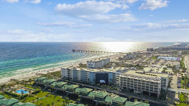 aerial view featuring a water view, a view of city, and a beach view