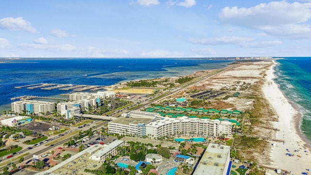 aerial view with a water view, a view of the beach, and a view of city