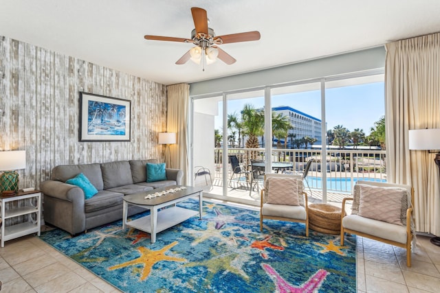 tiled living room featuring ceiling fan