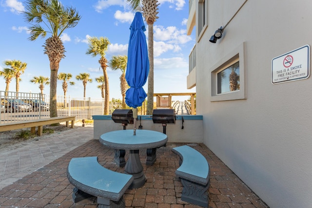 view of patio featuring fence