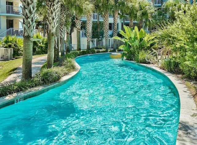 community pool featuring fence