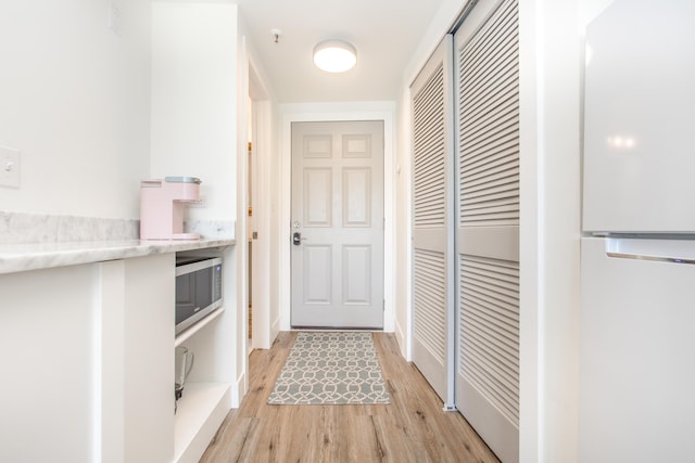 doorway featuring light wood-style flooring