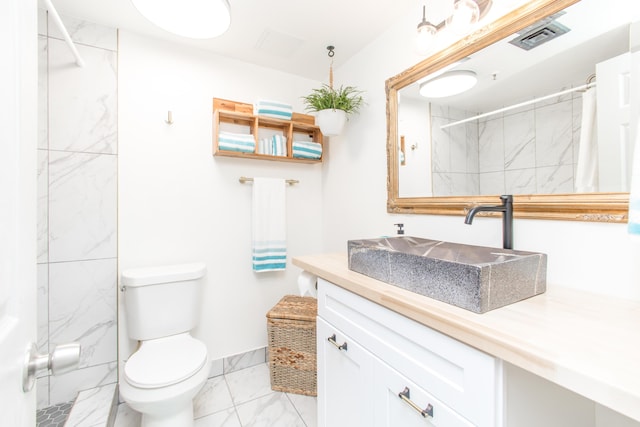 full bathroom with vanity, toilet, a shower with shower curtain, marble finish floor, and visible vents
