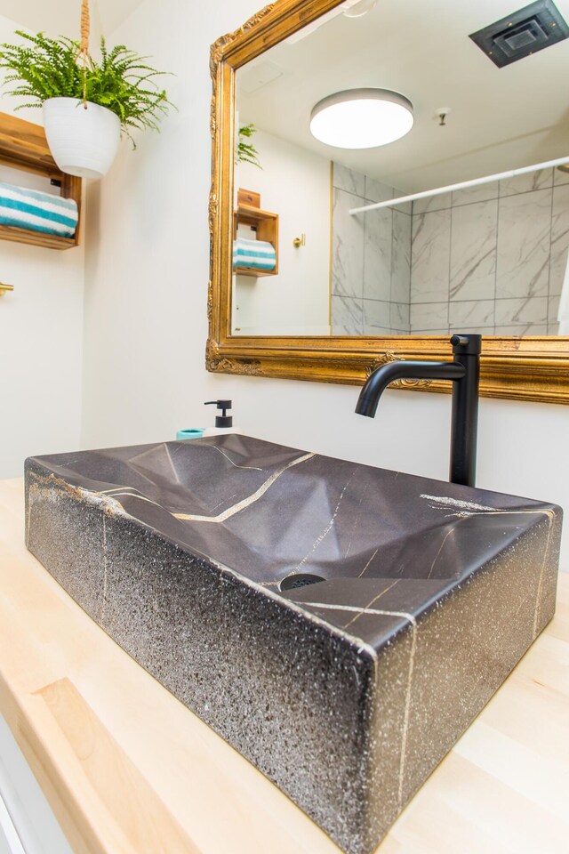 interior details with walk in shower and visible vents