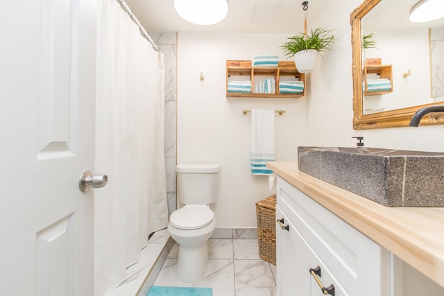 full bathroom featuring toilet, a shower with curtain, marble finish floor, and vanity