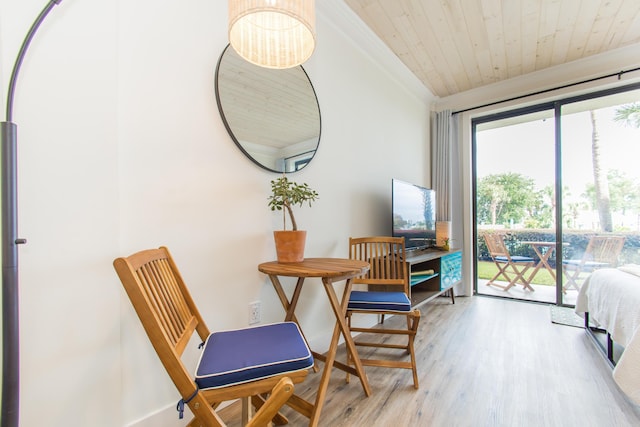 interior space with crown molding, baseboards, wood finished floors, and wooden ceiling