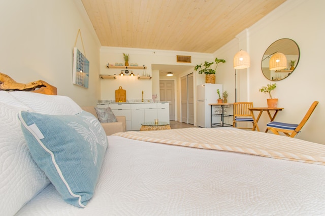 bedroom featuring freestanding refrigerator, crown molding, visible vents, and wooden ceiling