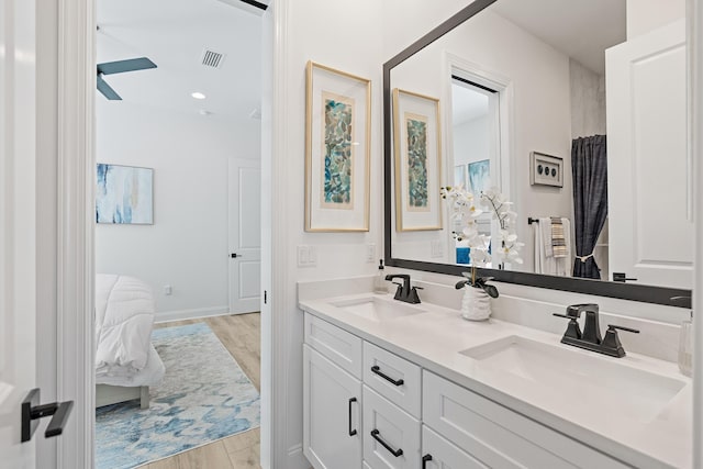 197 Suwannee Dr Lot 18, Watersound, FL 32461 - ensuite bathroom featuring wood finished floors, a sink, double vanity, and visible vents