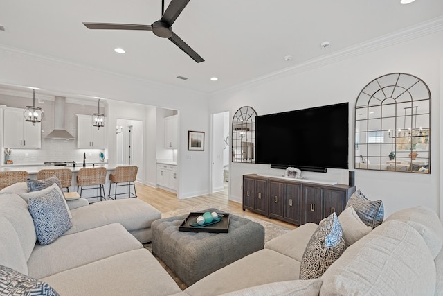 197 Suwannee Dr Lot 18, Watersound, FL 32461 - living room featuring baseboards, crown molding, light wood-style flooring, and ceiling fan