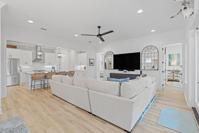 197 Suwannee Dr Lot 18, Watersound, FL 32461 - living area with crown molding, light wood-type flooring, visible vents, ceiling fan, and recessed lighting