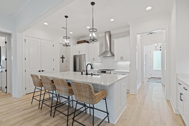 197 Suwannee Dr Lot 18, Watersound, FL 32461 - kitchen with high quality fridge, a sink, wall chimney range hood, decorative backsplash, and a kitchen island with sink