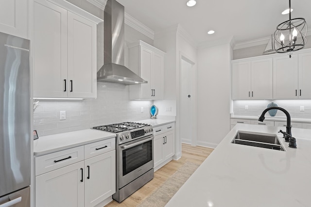 197 Suwannee Dr Lot 18, Watersound, FL 32461 - kitchen with crown molding, light countertops, a sink, wall chimney exhaust hood, and appliances with stainless steel finishes