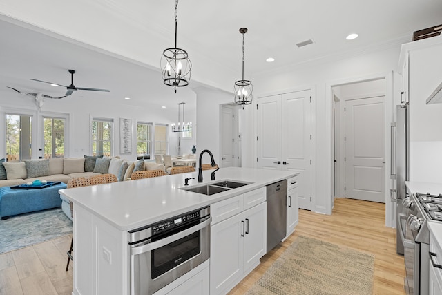 197 Suwannee Dr Lot 18, Watersound, FL 32461 - kitchen featuring a sink, white cabinetry, open floor plan, stainless steel appliances, and visible vents