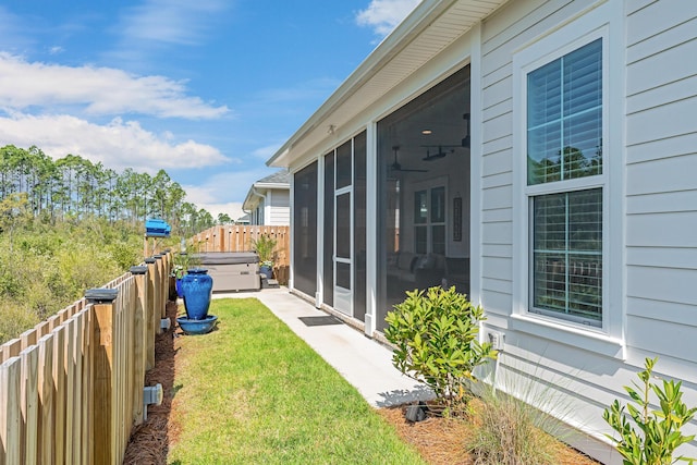 197 Suwannee Dr Lot 18, Watersound, FL 32461 - view of yard with a fenced backyard, a sunroom, and a hot tub