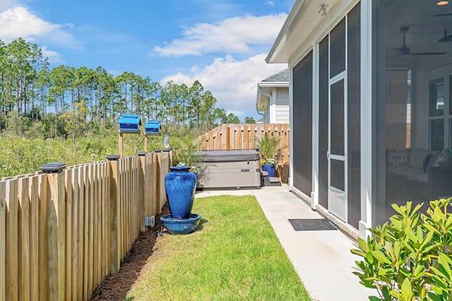 197 Suwannee Dr Lot 18, Watersound, FL 32461 - view of yard with a patio area, a sunroom, fence, and a hot tub