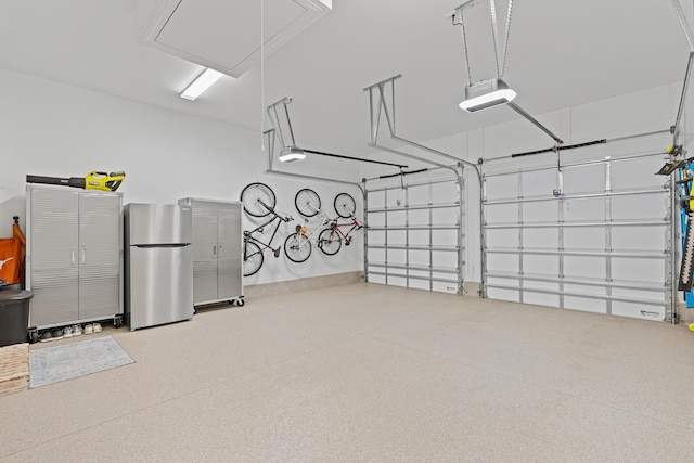 197 Suwannee Dr Lot 18, Watersound, FL 32461 - garage featuring a garage door opener and freestanding refrigerator
