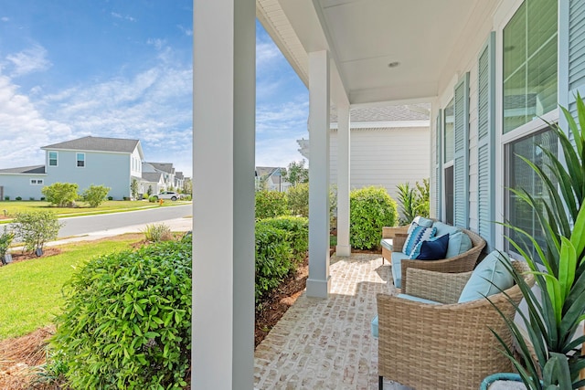 197 Suwannee Dr Lot 18, Watersound, FL 32461 - view of patio / terrace featuring a residential view and covered porch