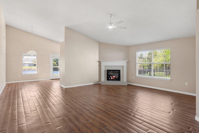 309 Wimico Cir, Destin, FL 32541 - unfurnished living room featuring ceiling fan, vaulted ceiling, wood finished floors, and a fireplace